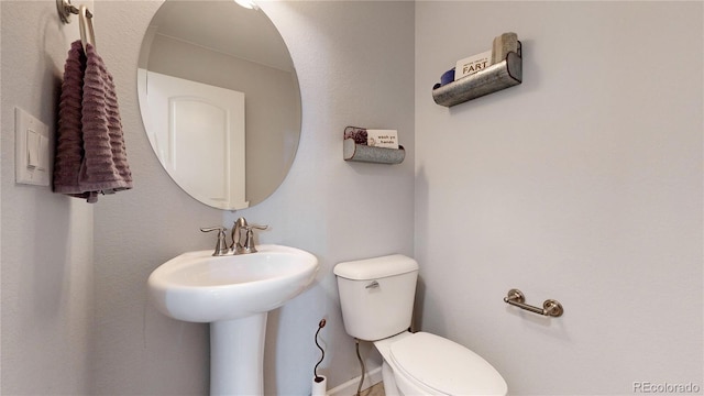 bathroom with toilet and sink