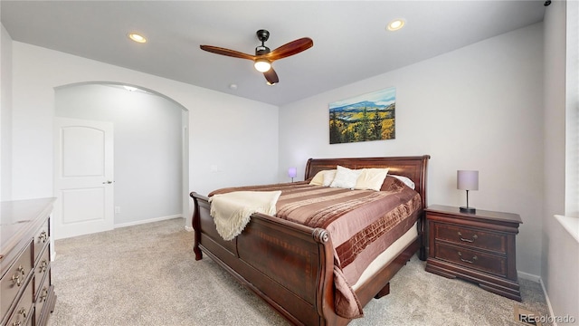 bedroom with light carpet and ceiling fan