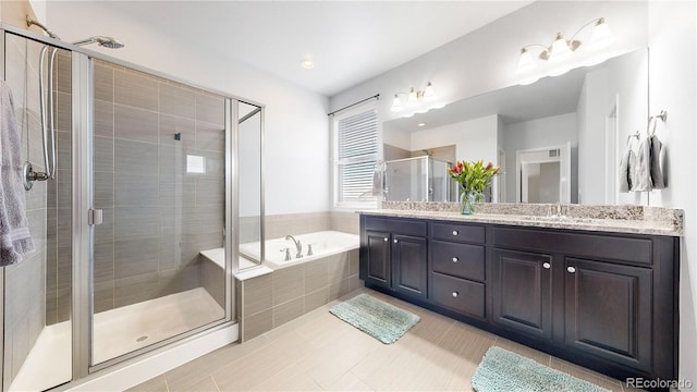 bathroom with vanity, separate shower and tub, and tile patterned floors