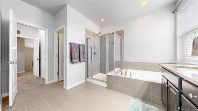 bathroom featuring vanity, separate shower and tub, and tile patterned floors