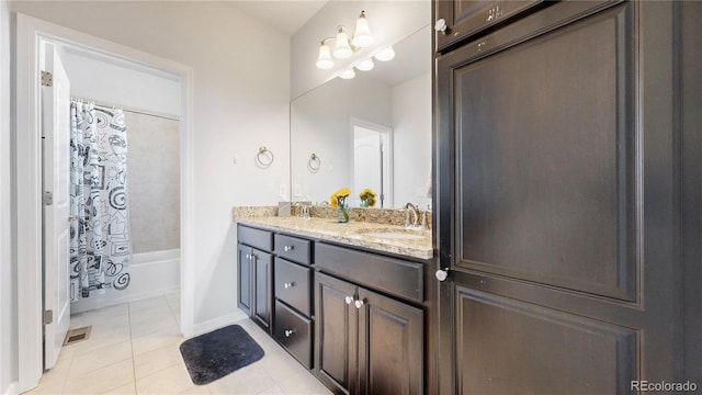 bathroom featuring shower / tub combo with curtain, vanity, and tile patterned flooring