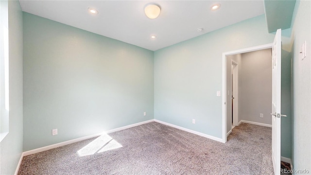 spare room with light carpet