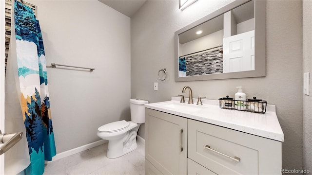 bathroom with vanity, curtained shower, tile patterned floors, and toilet