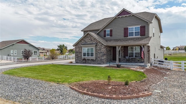 craftsman-style house with a front lawn