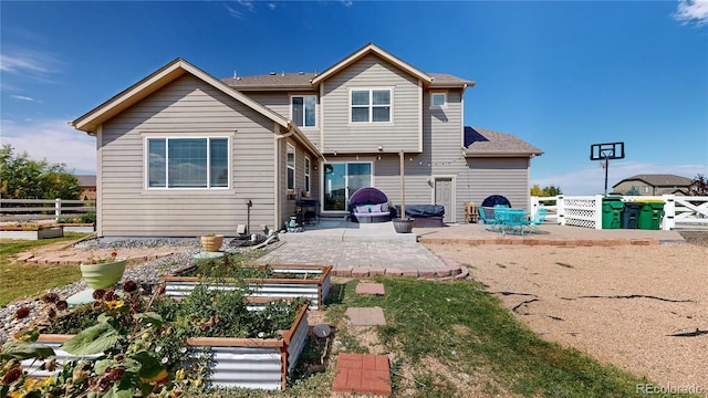 back of house with a patio area