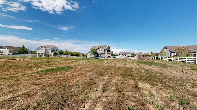 view of yard with a rural view