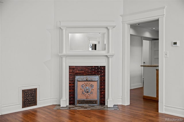 613 Pine St, Boulder, CO 80302 - room details with a fireplace, wood finished floors, visible vents, and baseboards