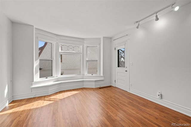 613 Pine St, Boulder, CO 80302 - unfurnished room with wood finished floors, baseboards, and a wealth of natural light