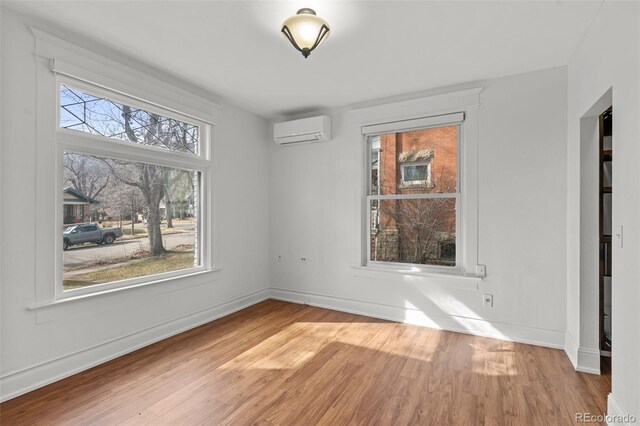 613 Pine St, Boulder, CO 80302 - unfurnished room with wood finished floors, baseboards, and a wall mounted AC
