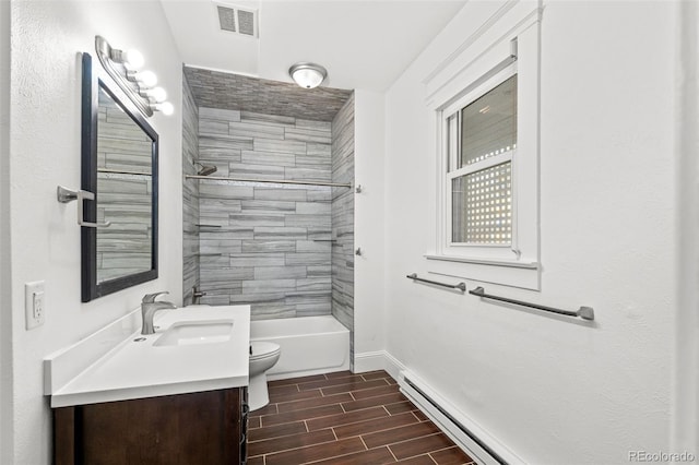 613 Pine St, Boulder, CO 80302 - bathroom with visible vents, baseboards, wood tiled floor, toilet, and vanity