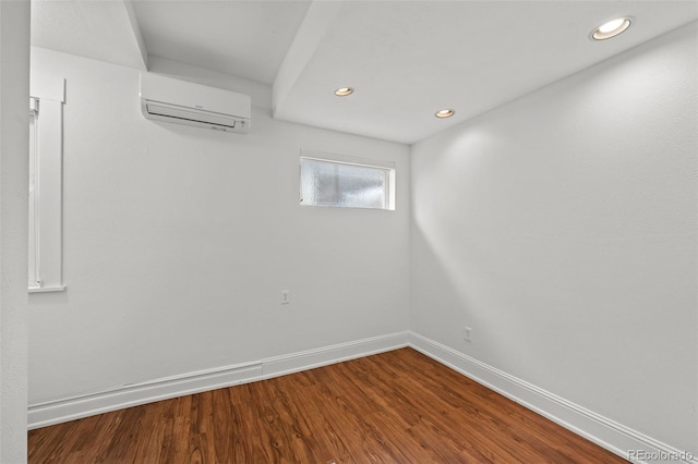 613 Pine St, Boulder, CO 80302 - spare room featuring an AC wall unit, wood finished floors, recessed lighting, and baseboards