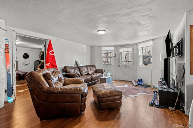 613 Pine St, Boulder, CO 80302 - living area featuring a textured ceiling and hardwood / wood-style flooring