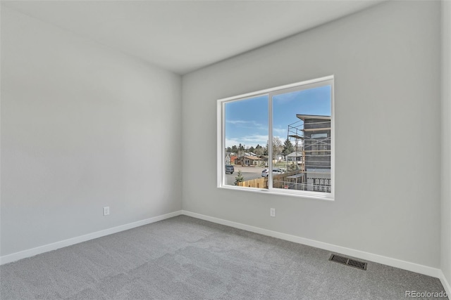 241 N Front St Unit 103, Monument, CO 80132 - empty room featuring carpet floors, visible vents, and baseboards
