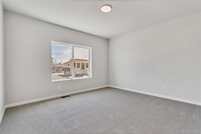 241 N Front St Unit 103, Monument, CO 80132 - carpeted spare room with baseboards and visible vents