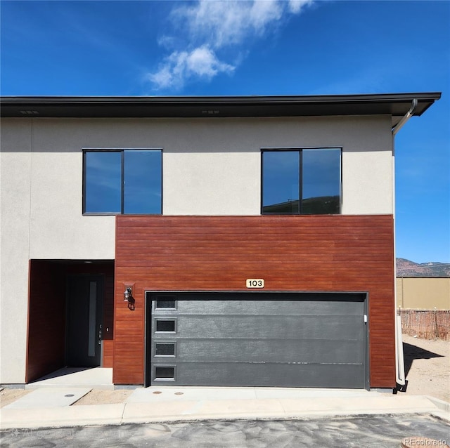 241 N Front St Unit 103, Monument, CO 80132 - contemporary home featuring an attached garage and stucco siding
