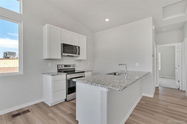 241 N Front St Unit 103, Monument, CO 80132 - kitchen featuring light wood-type flooring, visible vents, stainless steel appliances, and a sink