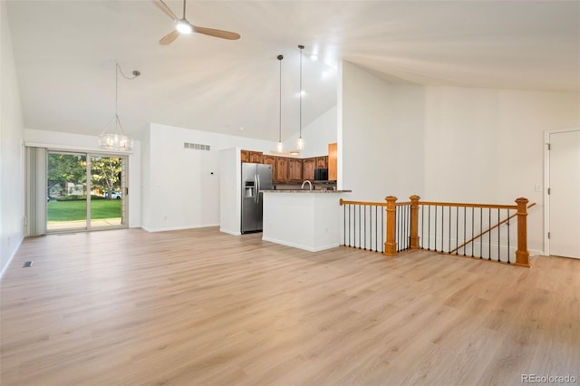 1460 Front Nine Dr Unit A, Fort Collins, CO 80525 - unfurnished living room featuring high vaulted ceiling, ceiling fan, and light wood-style floors