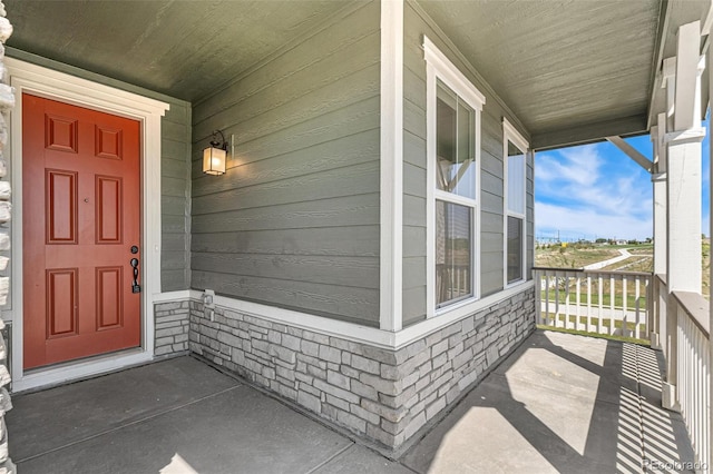 entrance to property featuring a porch