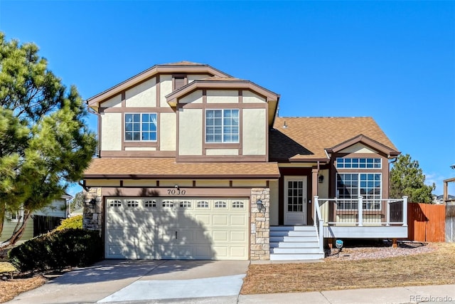 tudor-style house with a garage