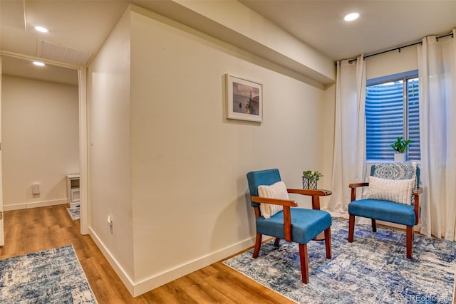 living area featuring hardwood / wood-style flooring