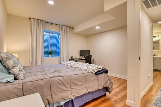 bedroom featuring light hardwood / wood-style floors