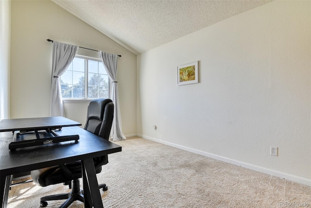 carpeted office featuring lofted ceiling and a textured ceiling