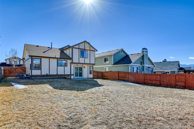 rear view of property with cooling unit