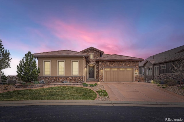 view of front facade featuring a garage, concrete driveway, a tile roof, and stone siding