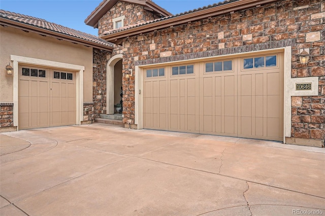 garage featuring driveway