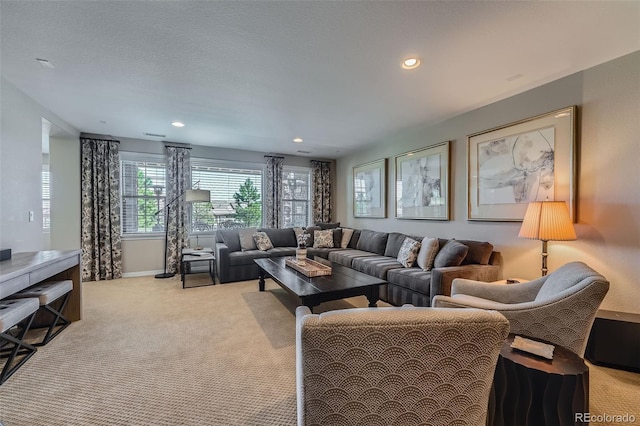 living area with baseboards, carpet, and recessed lighting