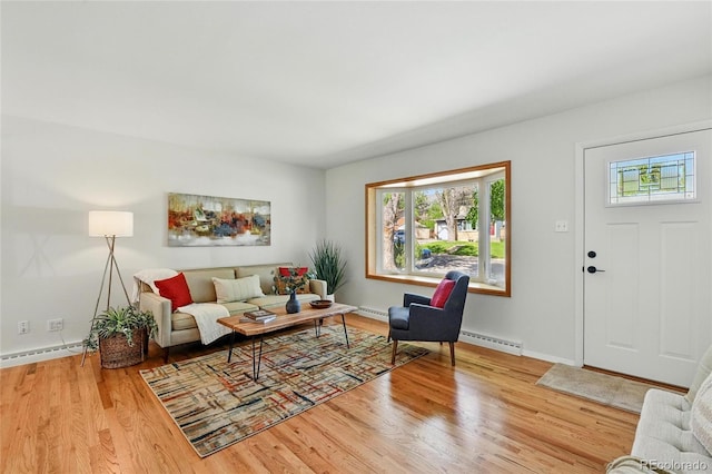 12162 W Dakota Dr, Lakewood, CO 80228 - living area with a baseboard heating unit, wood finished floors, baseboards, and a baseboard radiator