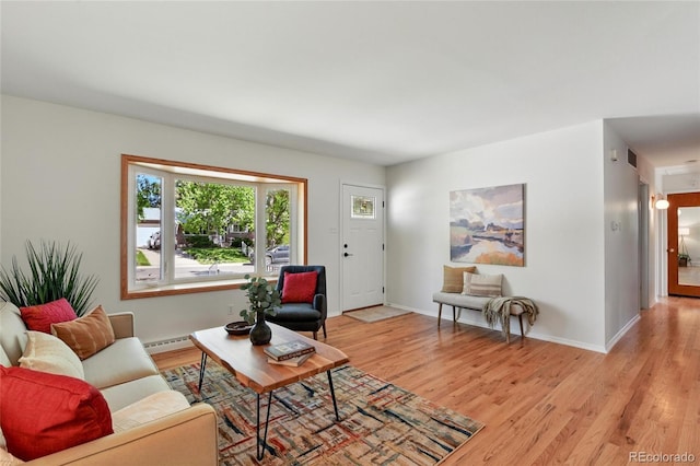 12162 W Dakota Dr, Lakewood, CO 80228 - living room with light wood-type flooring, baseboards, and baseboard heating