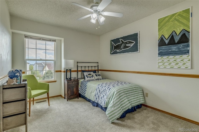 6041 Pioneer Mesa Dr, Colorado Springs, CO 80923 - bedroom featuring carpet floors, a textured ceiling, baseboards, and ceiling fan
