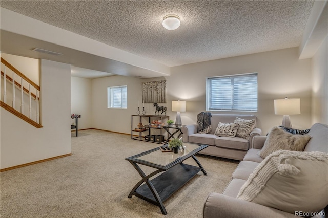 6041 Pioneer Mesa Dr, Colorado Springs, CO 80923 - living room featuring light carpet, stairway, baseboards, and a textured ceiling