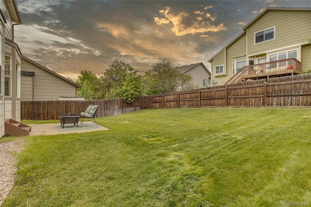 6041 Pioneer Mesa Dr, Colorado Springs, CO 80923 - yard at dusk featuring a patio area and an outdoor fire pit