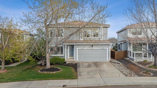 4526 Lyndenwood Pt, Highlands Ranch, CO 80130 - traditional home featuring driveway, an attached garage, and a front yard