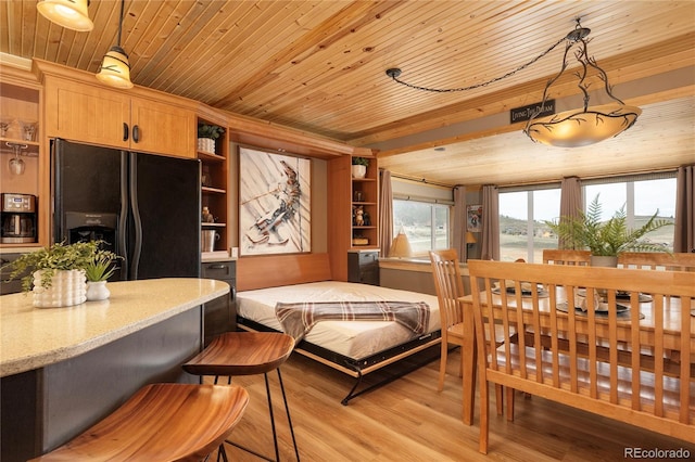 96 Mountain Side Dr Unit B61, Granby, CO 80446 - bedroom featuring black fridge with ice dispenser, wooden ceiling, and light wood-style floors