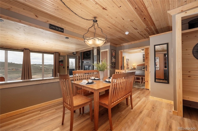 96 Mountain Side Dr Unit B61, Granby, CO 80446 - dining space featuring baseboards, wooden ceiling, light wood-type flooring, and crown molding
