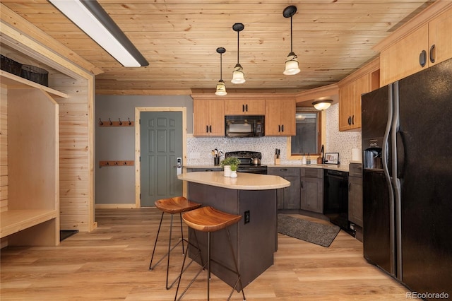 96 Mountain Side Dr Unit B61, Granby, CO 80446 - kitchen with black appliances, a kitchen bar, light countertops, a center island, and wood ceiling