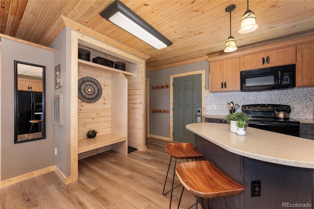 96 Mountain Side Dr Unit B61, Granby, CO 80446 - kitchen with black appliances, wood ceiling, backsplash, light wood-style flooring, and baseboards
