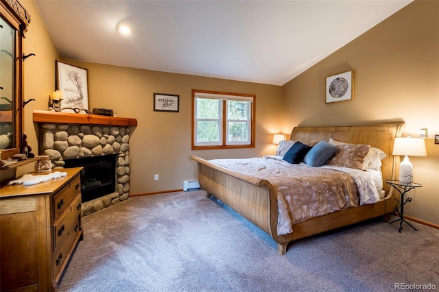 33 Sparrow Ct, Bailey, CO 80421 - carpeted bedroom featuring lofted ceiling, a stone fireplace, and a baseboard heating unit