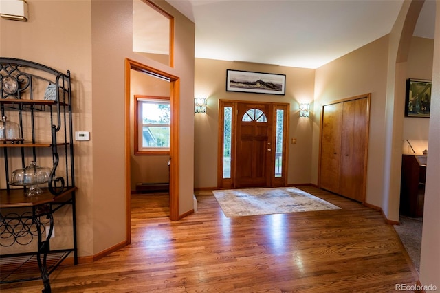 33 Sparrow Ct, Bailey, CO 80421 - foyer entrance featuring wood finished floors and arched walkways