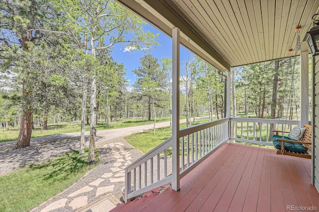 33 Sparrow Ct, Bailey, CO 80421 - wooden porch with view of wooded area