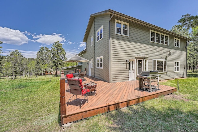 33 Sparrow Ct, Bailey, CO 80421 - rear view of house with a yard and a wooden deck