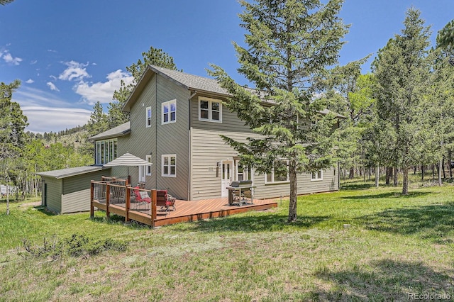33 Sparrow Ct, Bailey, CO 80421 - rear view of property with a deck and a yard