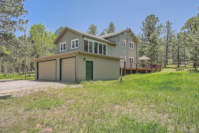 33 Sparrow Ct, Bailey, CO 80421 - view of side of property featuring a deck and an attached garage