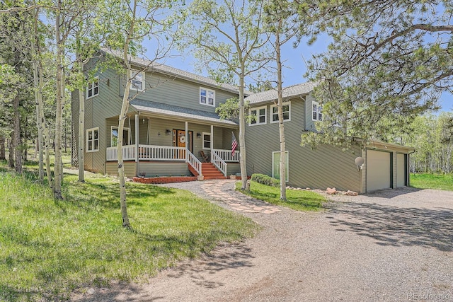 33 Sparrow Ct, Bailey, CO 80421 - view of front of property featuring a porch, dirt driveway, and a garage