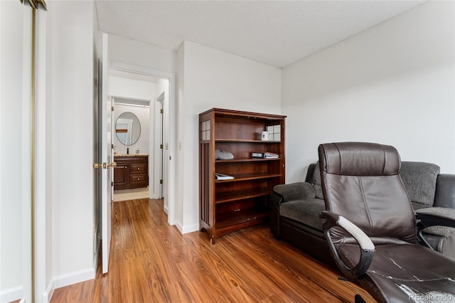 home office with hardwood / wood-style floors