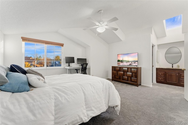 carpeted bedroom featuring ceiling fan, lofted ceiling, and a textured ceiling