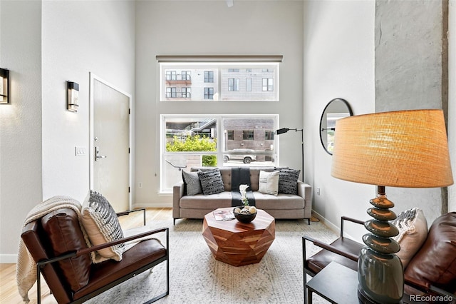 2518 16th St, Denver, CO 80211 - living area featuring a towering ceiling and baseboards
